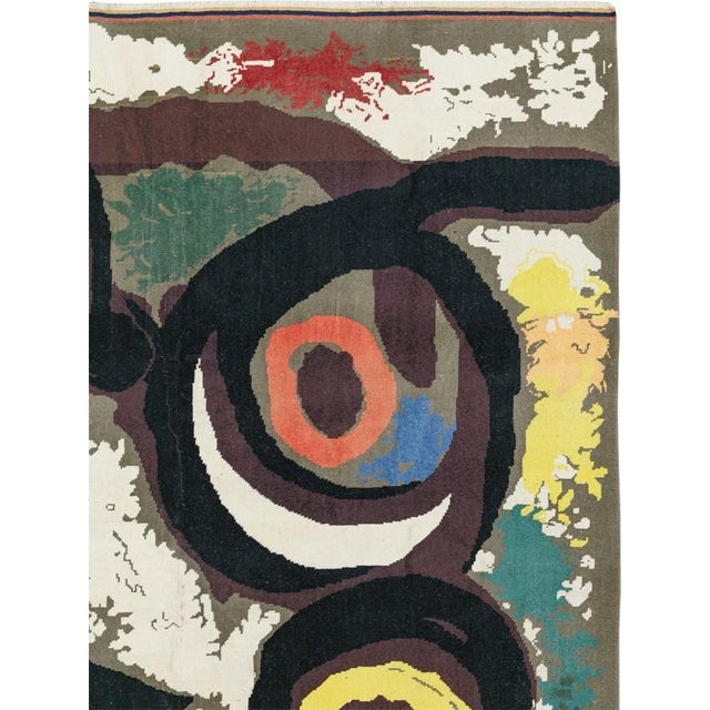 This is a modern or vintage artist-designed art rug created in the style of or after the iconic Spanish Surrealist artist...