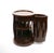 A refined Mid-Century Modern side table crafted from richly grained mahogany, featuring a distinctive cylindrical, drum-...