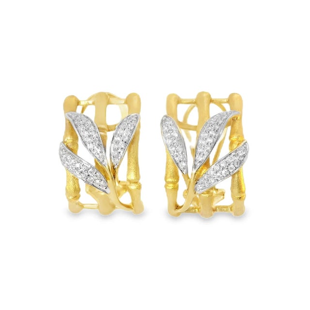 14K yellow gold earrings with numerous round diamonds totaling 0.4 carats. Earring dimensions 3/4 inch long by 1/2 inch...