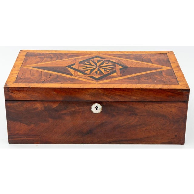 American Marquetry Writing Box, 19th century, the top with geometric starburst inlay of maple, ebony, rosewood, and burl...
