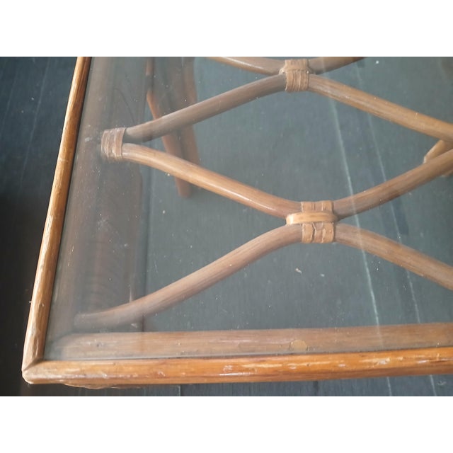 Vintage 1970s bamboo side table. Nice bent bamboo wood design. Plain glass top insert. Light amber color finish. I love it...