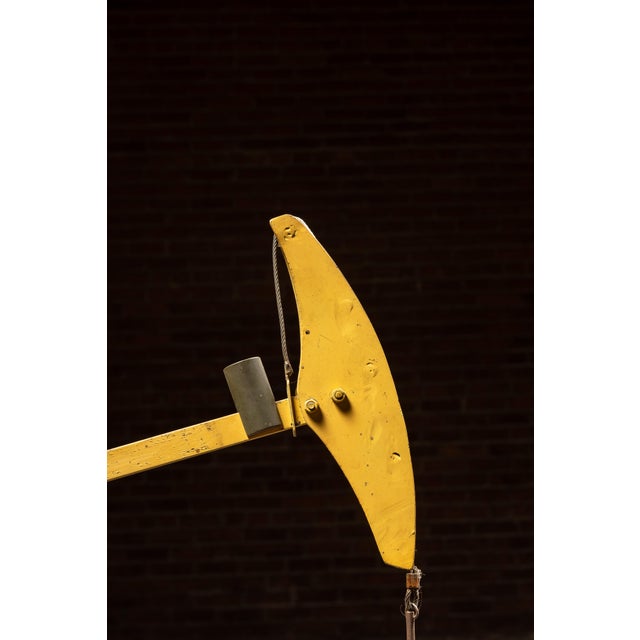 Mechanical salesman's model simulating the operation of an oilfield pumpjack, mounted to a painted wooden base and driven...