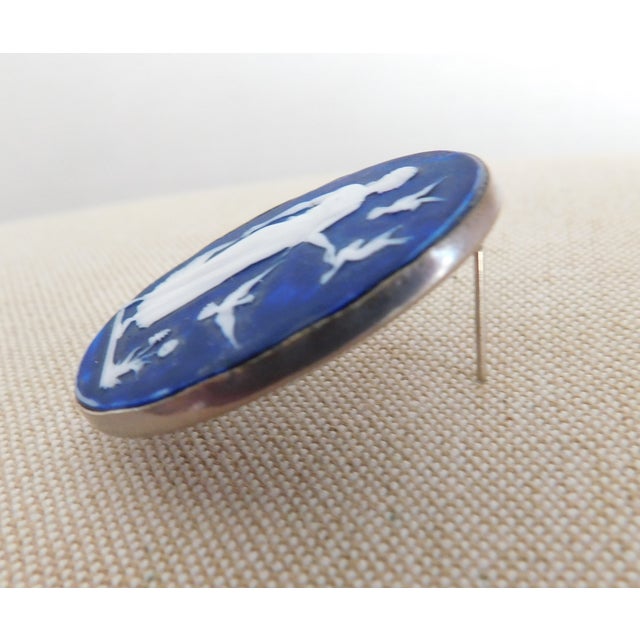 Beautifully carved Italian dark blue cameo brooch in a sterling silver mounting. The brooch measures about 1.5 inches high...