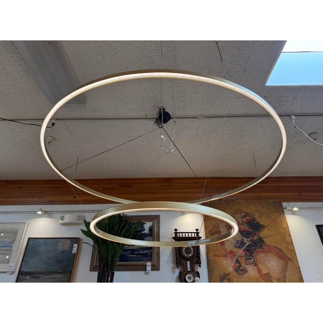 Design Plus Gallery presents a Pendant Light with Double Rings. The ultra-modern pendant has two circles that hang from...