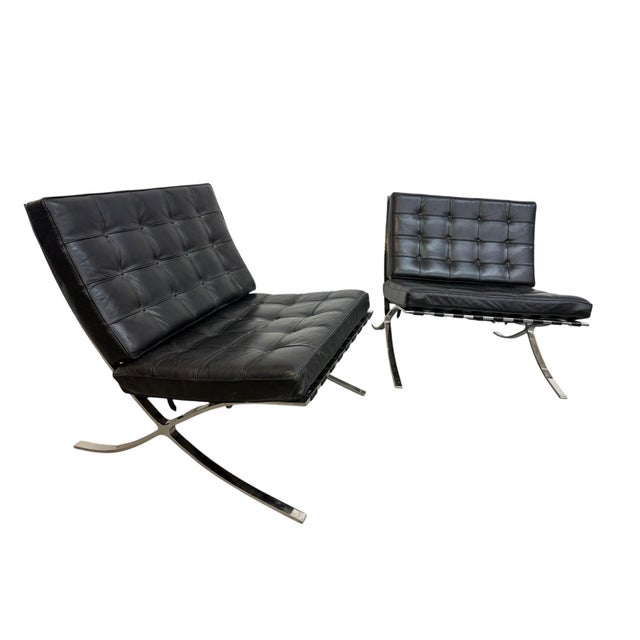 Iconic pair of vintage Barcelona lounge chairs, circa 1970s, showcasing the timeless Ludwig Mies van der Rohe design....