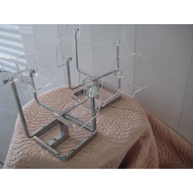 Midcentury modern 1960s chrome and lucite hat display stands in excellent condition. Th e chrome base measures 8"x8" and...