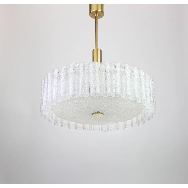 Fantastic midcentury chandelier by doria, germany, manufactured circa 1970-1979, with 35 murano glass cylinders suspended...