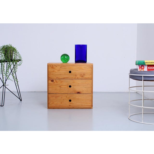 Small square drawer cabinet by Ate van Apeldoorn. The natural pine highlights the wood grain, and the finger-jointed...