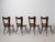 This set of four dining chairs was produced in Italy during the 1950s and reflects the clean, sculptural lines typical of...
