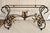 Here is a stunning mid-century Hollywood Regency iron and glass console table, dating to the 1950s–1960s, featuring...