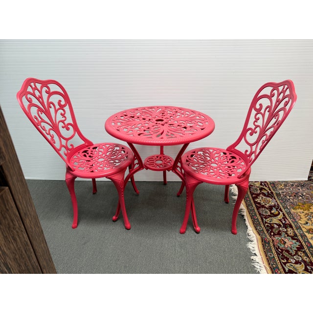 Design Plus Gallery presents a Set of Three Lipstick Red Dining Setting from Alfresco Home. This sweet set contains two...