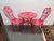 Design Plus Gallery presents a Set of Three Lipstick Red Dining Setting from Alfresco Home. This sweet set contains two...