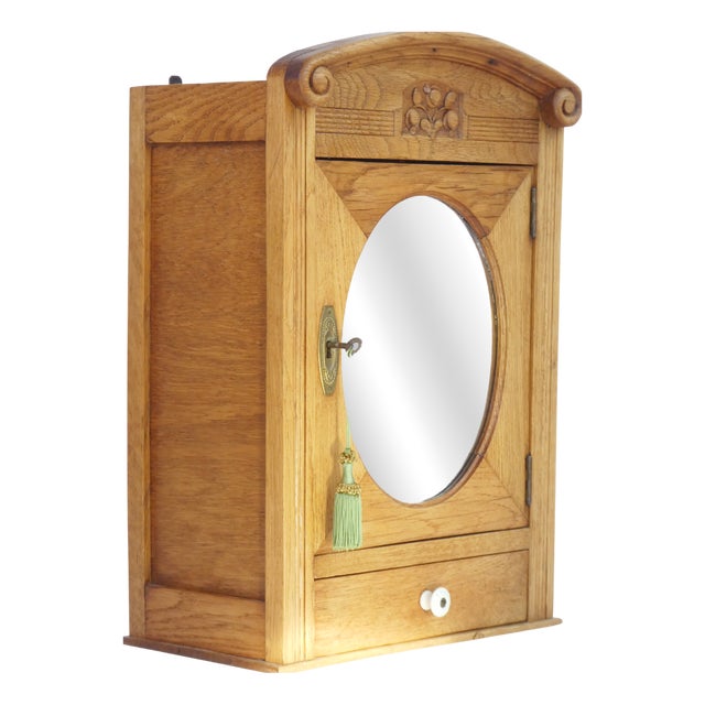 Small Art Deco Floral Carved Wooden Cabinet with Oval Beveled Mirror, 1920s For Sale