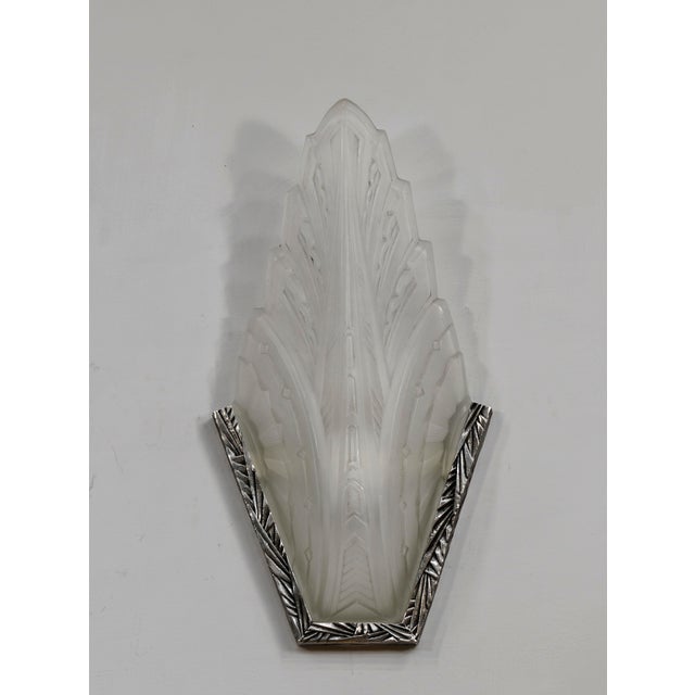 Verreries des Hanots A pair of large French art deco wall sconces. Made around 1930 in nickel plated solid brass or...