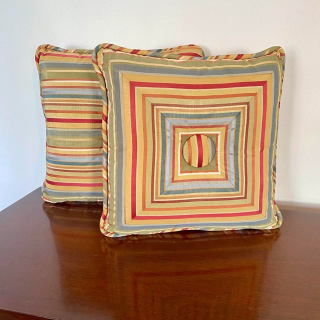Set of two vintage accent pillows sewn from multicolor striped taffeta in gold, coral, sage, and blue tones. The fabric...