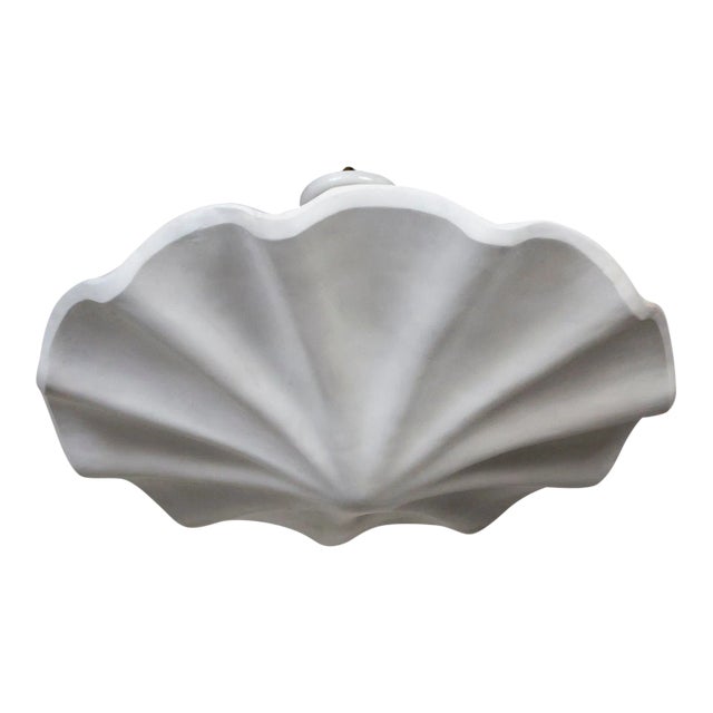 A plaster pendant in a smooth, undulating shell shape, with scalloped edges. A newer take on Francis Elkins's 1940s...