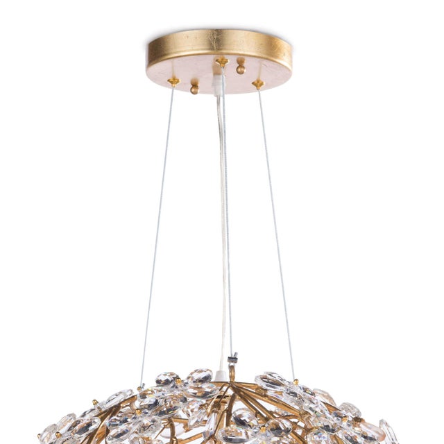 Delicately crafted crystal flowers suspended by gold frame, gives this chandelier a strikingly romantic feel. The hand-...