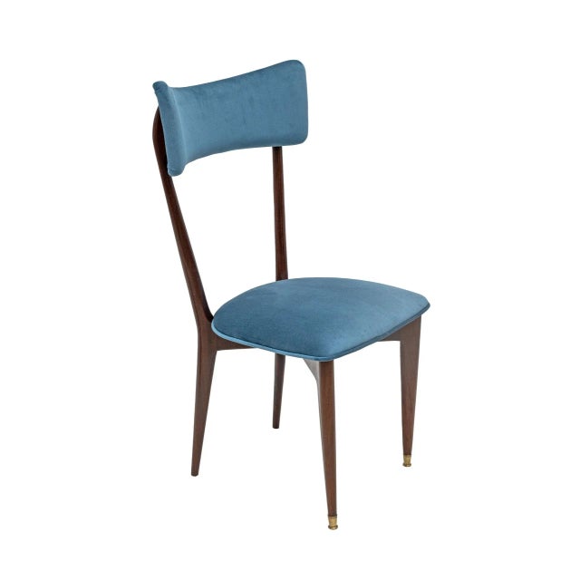 Set of six rare Italian rosewood dining chairs from the 1950s. Sculptural frame with a gently curved, upholstered...