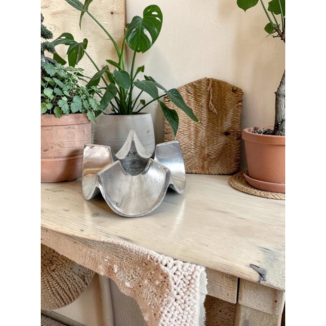 This MCM Atomic Metal Candle Holder is a stylish and unique addition to any space. The star-shaped design, made of solid...