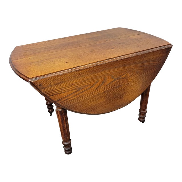 Antique English Chestnut Drop-Leaf Dining Table With Five Turned Legs and Castors, C. 1820–1840 For Sale