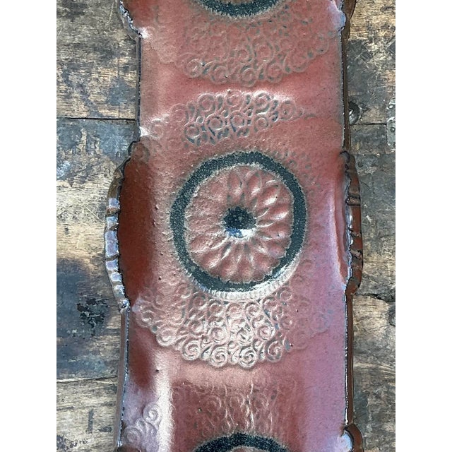This striking vintage studio pottery tray is a masterclass in organic texture and mid-century artisanal craftsmanship....