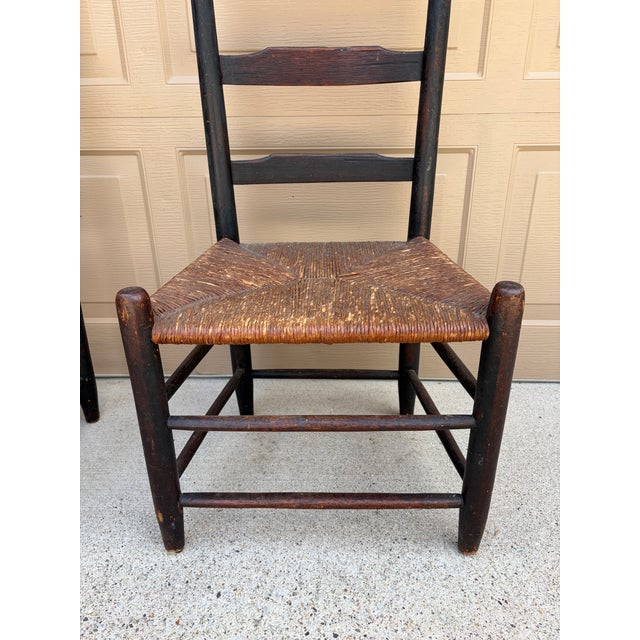 Pair of Antique Black Painted Shaker Ladder Back Chairs With Rush Seats For Sale - Image 11 of 18