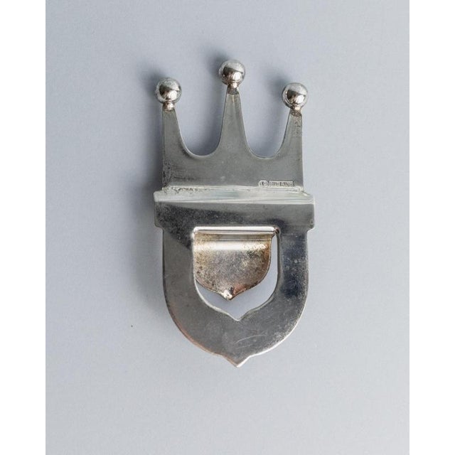 This vintage bottle opener from 1980s Italy is a refined piece of barware, silver plated and crafted in an elegant crown...