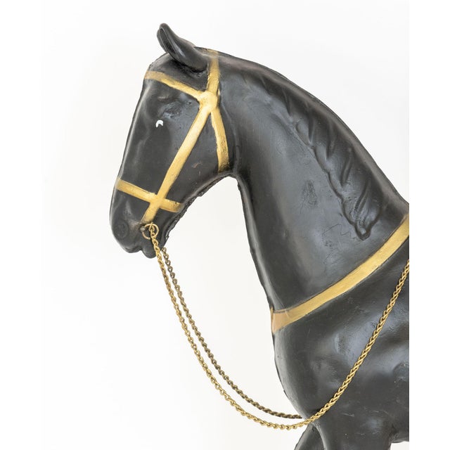 American Carousel Horse Form Weathervane, gilt and ebonized sheet metal. 55" H x 3" W x 20" D. Provenance: From a 500 Park...