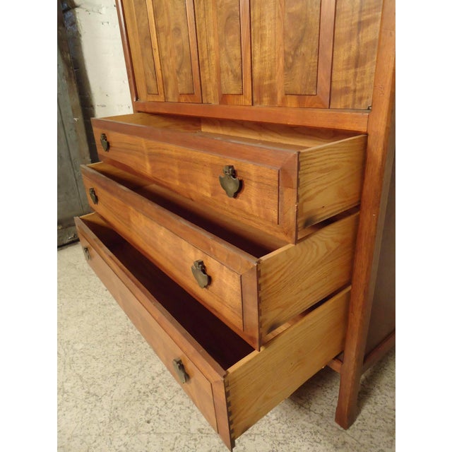 Handsome dresser by Widdicomb with walnut grain, six total drawers, brass spade handles. Back has a finished wood panel....