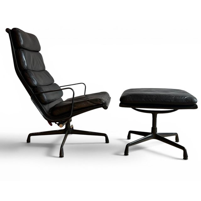 Fantastic Eames Soft Pad lounge Chair and Ottoman with black leather. Unusual dark graphite frame makes this a rare find....