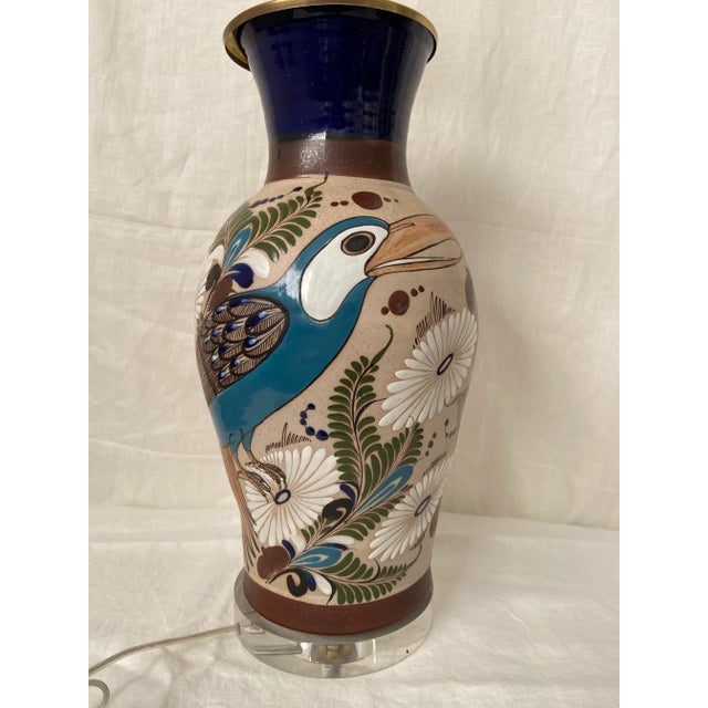 Mexican pottery vase mounted to an acrylic base and wired to use as a lamp. Shade not included. Wired for the US. Signed...
