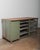 This early 20th-century industrial metal workbench is a striking example of utilitarian craftsmanship. Built entirely from...
