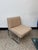 Elegant upholstered cantilever lounge chair dating from approximately the 1970s. The chair features a sculptural tubular...