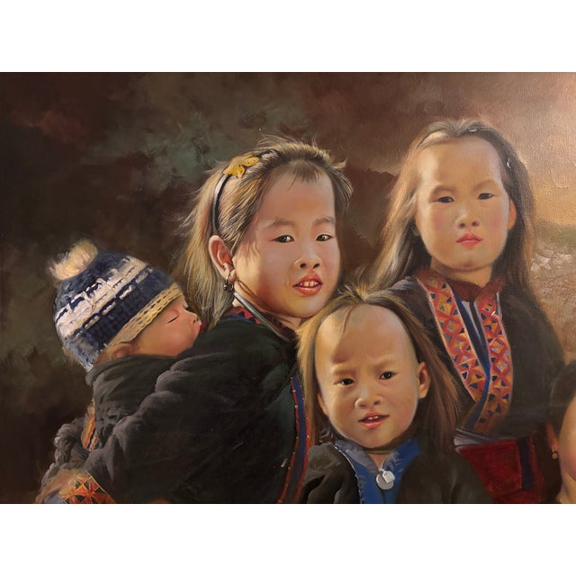 H s t group of hmong children in traditional dress, signed and framed in a good condition american box frame this piece...
