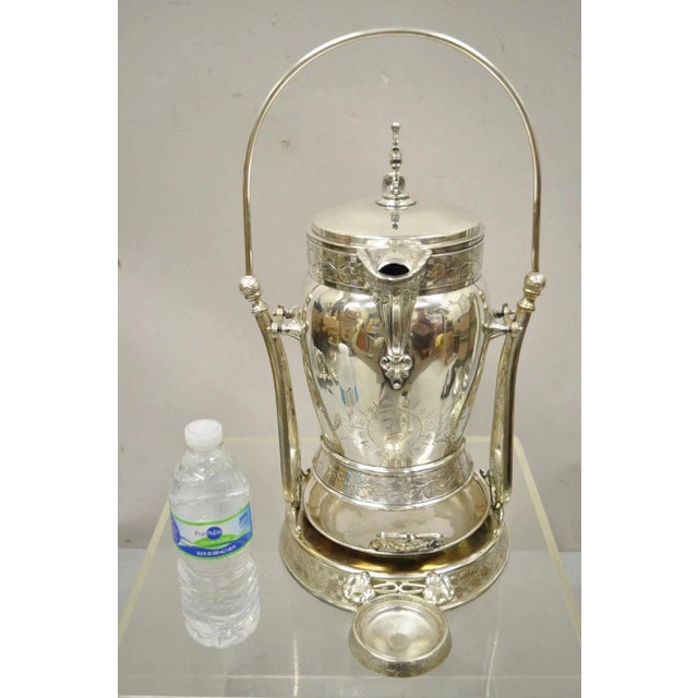 Antique Wilcox Silver Plated Victorian Ornate Tilt Stand Water Lemonade Pitcher. Item features a highly decorated form,...