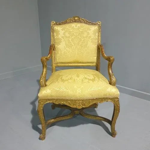 This is a super 19th Century English Victorian antique gilt elbow chair upholstered in gold damask, in excellent original...