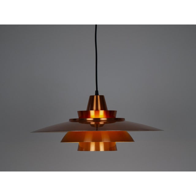 An aluminum lamp from the Danish brand Superlight, designed in the 1980s by David Mogensen. The lamp's form is based on...