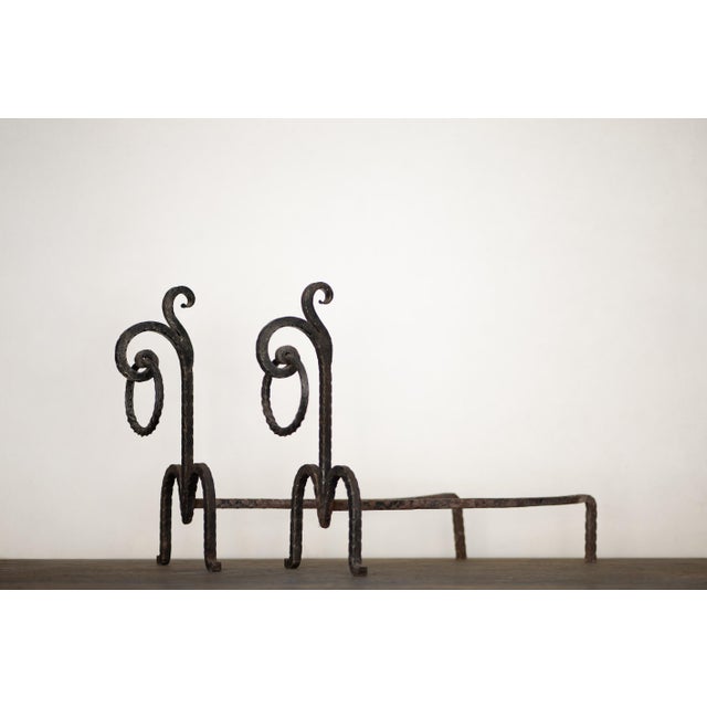 A pair of hand-forged Brutalist wrought iron andirons. Made in Italy in the 1970s. Exquisite craftsmanship. Excellent...