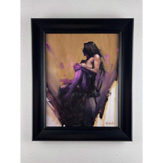 The artwork presents a solitary figure seated in a contemplative pose, enveloped in a rich interplay of warm and cool...