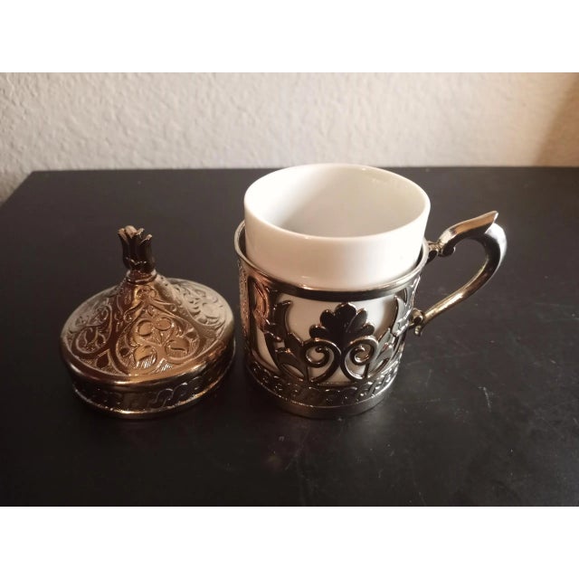 It is a sterling Silver Demitasse Cup Holder. Great collectible & Decor piece. Procured at antique mall on Arizon road trip.