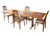 A set of four Benny Linden chairs. Crafted in solid teak and known for their ergonomic, gently curved high backs....