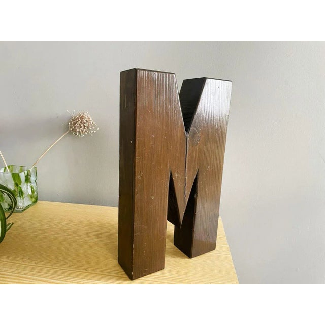 "M" is a part of our stunning collection of large vintage industrial wooden letters. Crafted from solid wood, each letter...