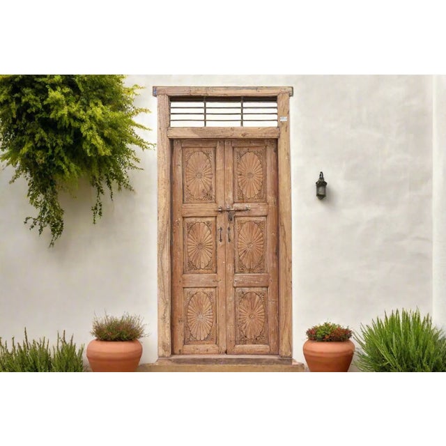A charming statement piece, this 19th century Portuguese colonial antique door is a fine example of masterful...