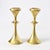 Set of two mid-century modern candleholders. Made of thick, cast brass. Possibly made in Germany.