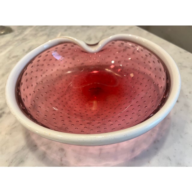 Gorgeous mid-century art glass bowl attributed to Murano. The organic, softly folded and swirled form is sculpted in a...