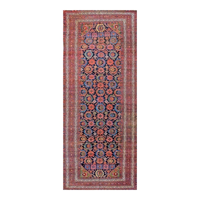 Striking Bold Colors in a Navy Background Antique Persian Malayer Gallery Rug For Sale