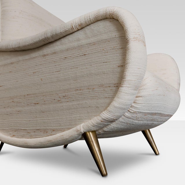 New uphlostery in ivory jacquard fabric and original brass details with vintage patina. This piece is attributed to the...