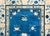 A wonderful early 20th century Chinese Peking rug with a central peony medallion living amidst a field of more peonies,...