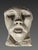 This sculpture is a votive head from a Gallic (Celtic) temple, made of limestone. Late La Tène period / 2nd – 1st century...