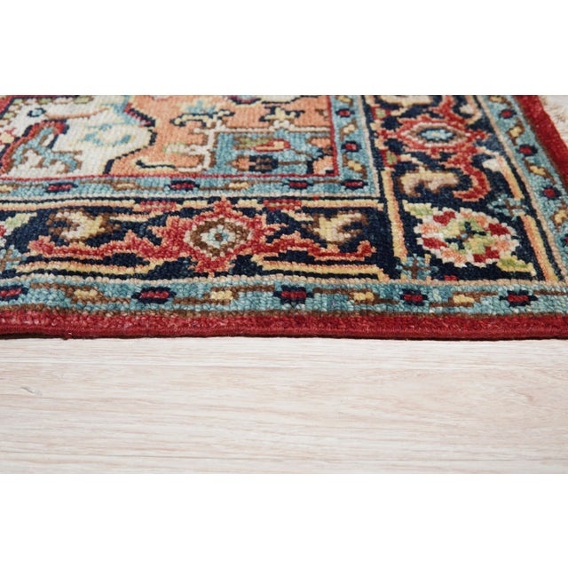 Louie Oriental Red Hand Knotted Wool Rug, Country of Origin: India. This exceptional piece is defined by its rich,...
